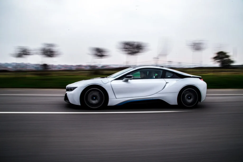 high speed test driving white sport car_1_40 min 1024x683